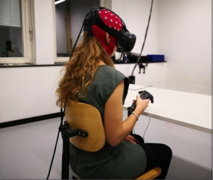 Participant equipped with both EEG and VR headsets for our study on error potentials.