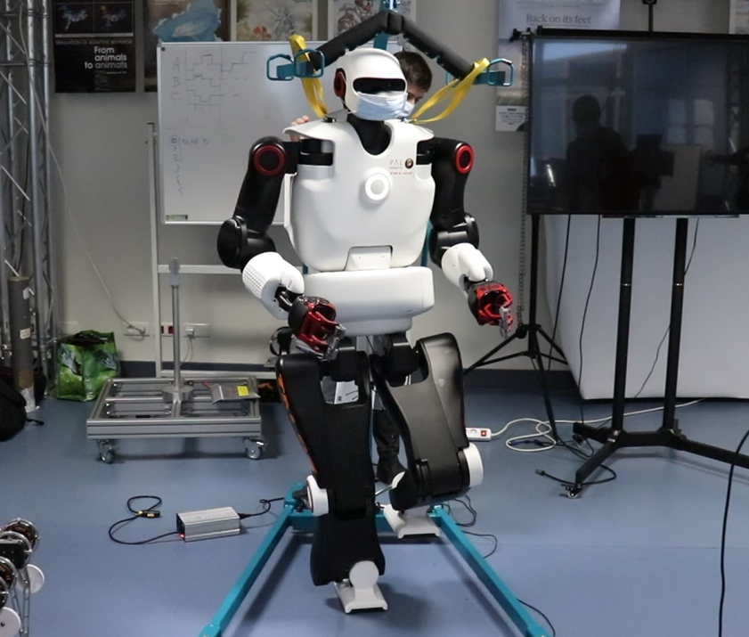Talos on one foot, running our whole-body controller. At 1000 Hz, the robot uses a quadratic programming solver to compute the position of the 32 joints so that the feet and the hands are at the right position while (1) ensuring that the center of mass stays on top of the center of the foot, (2) there is no self-collision, (3) all the joint limits, velocity limits, and acceleration limits are respected. The ZMP (Zero Moment Point) stabilizer uses the force-torque sensor of the ankle to reject external perturbations.