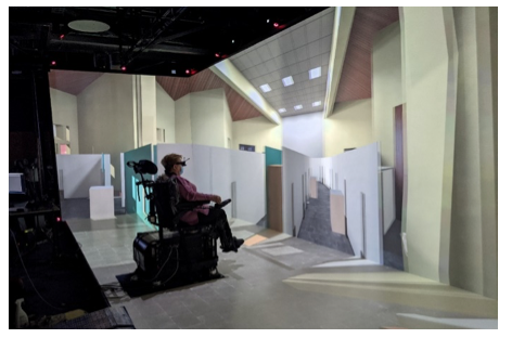 The wheelchair simulator tested by a volunteer in immersive conditions.